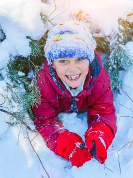 Boy playing in big snow in winter. 写真素材