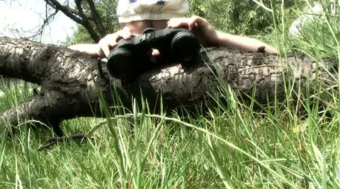 Boy playing with binoculars Stock Footage 11234529