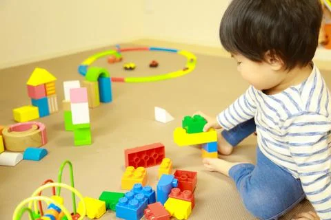 Boy playing with blocks Stock Photos