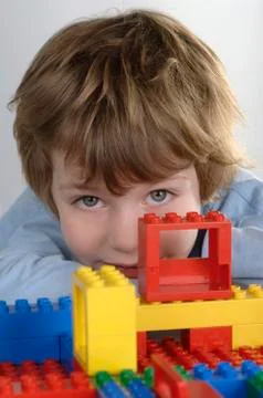 Boy playing with bricks Stock Photos