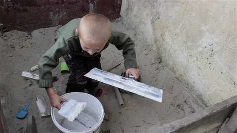 Boy playing builder Stock Footage 75198012