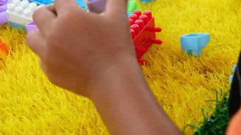Boy playing building blocks. educational concept to train creativity Stock-Footage 310245450