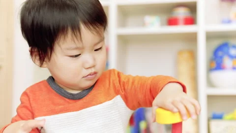 A Boy Playing with Building Blocks Stock-Footage 327593480
