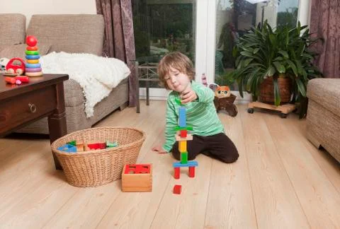 Boy playing with building blocks Fotos de archivo