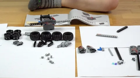 Boy playing with building blocks. Small engineer genius constructing  Stock Footage 125484739