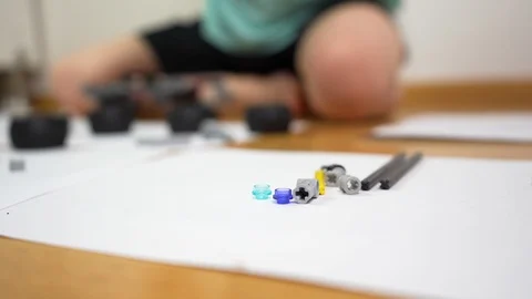 Boy playing with building blocks. Small engineer genius constructing  Video stock 125485289