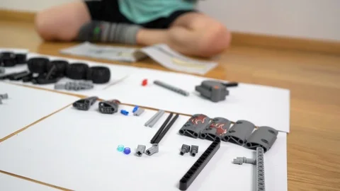 Boy playing with building blocks. Small engineer genius constructing  Stock Footage 125485461