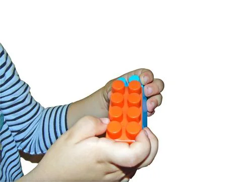A boy is playing with building cubes 库存照片
