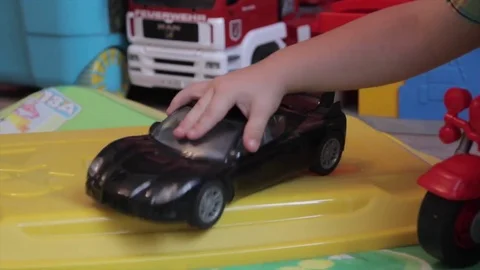A boy playing with a car Video stock 71474434