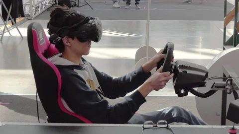 Boy playing a car racing game with virtual reality glasses Stock-Footage 104100426