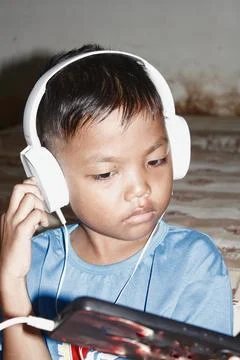 Boy playing with cellphone Stock-Fotos