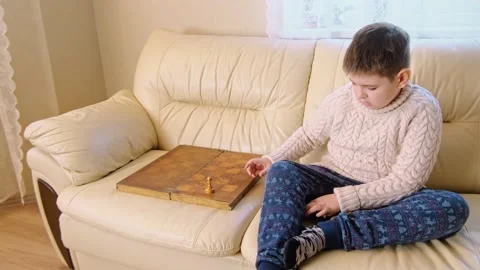 A boy playing chess with himself Video stock 150384856