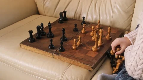A boy playing chess with himself Video stock 150384876