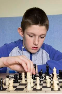 A boy playing chess Stock Photos