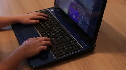 Boy playing computer game Stock Footage 70940574