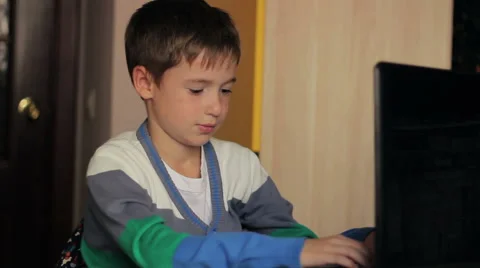 Boy playing computer at  home headache 動画素材 55675242