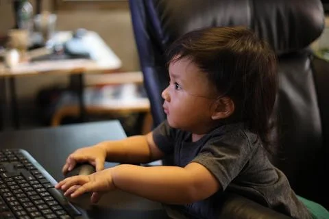 Boy Playing On Computer At Home Stock Photos