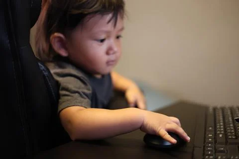 Boy Playing On Computer At Home Stock Photos