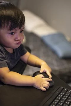 Boy Playing On Computer At Home Stock Photos