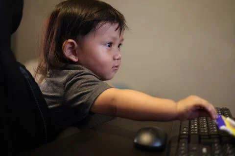 Boy Playing On Computer At Home Stock Photos