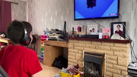 Boy playing on a console Stock Footage 240012547