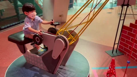 A boy playing crane model Stock Footage 175682773