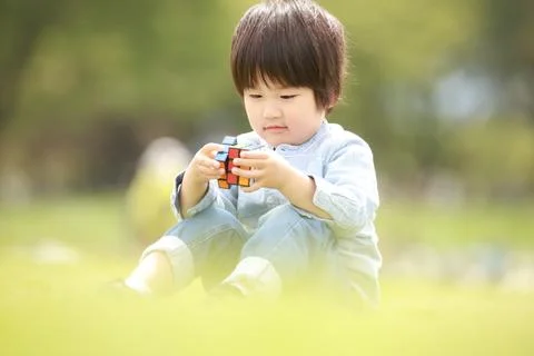 Boy playing with cubes Stock Photos