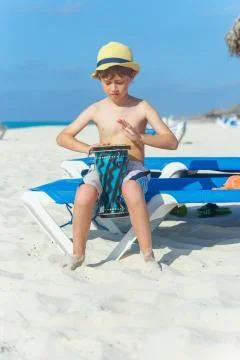 Boy playing on darbuka Stock Photos