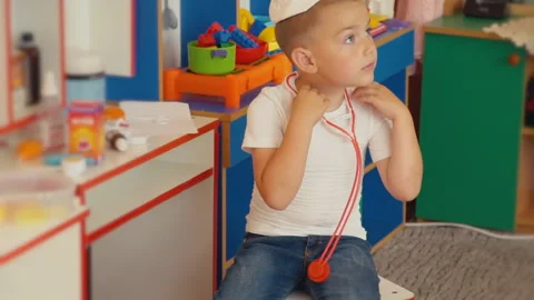 Boy playing doctor Stock Footage 93538692