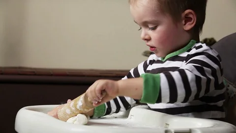 Boy playing with dough 스톡 동영상 100468289