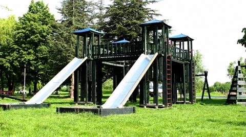 Boy playing down the slide Stock Footage 5218155