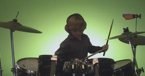 Boy playing drums in slow motion Stock Footage 99990805