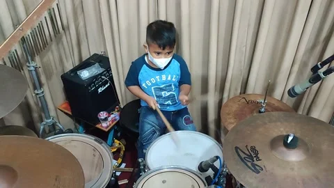 A boy playing drums in the studio Stock Footage 206037173