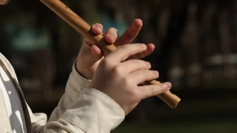 Boy is playing the duduk 1 Stock Footage 333590356