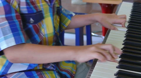 Boy playing on electone Stock Footage 53093422