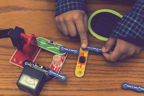 The boy playing an electric constructor. The child is played by intellectual  Stock Photos