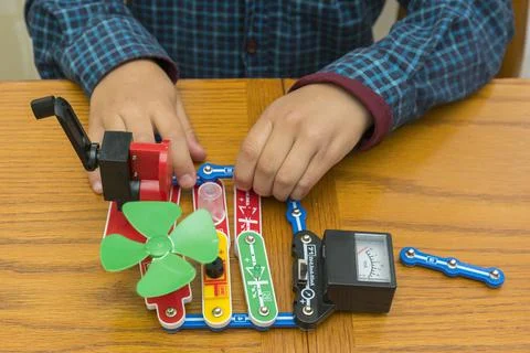 The boy playing an electric constructor. The child is played by intellectual  Stock Photos