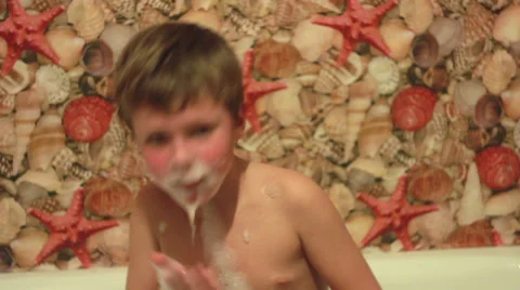 Boy Playing with Foam 2 Stock Footage 32906692