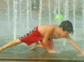 Boy Playing in Fountain SD Footage