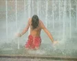 Boy Playing in Fountain SD Footage