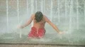 Boy Playing in Fountain HD Footage
