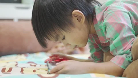 Boy Playing game on bed 스톡 동영상 192444531