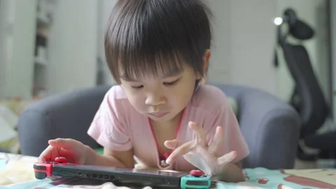 Boy Playing game on bed 스톡 동영상 196005075