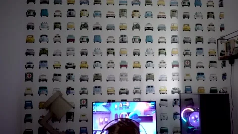 Boy playing game on computer in the dark Stock Footage 148630196