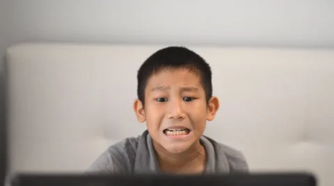 Boy playing game on computer Stock Footage 57333590