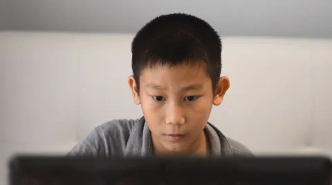 Boy playing game on computer Stock Footage 57361593