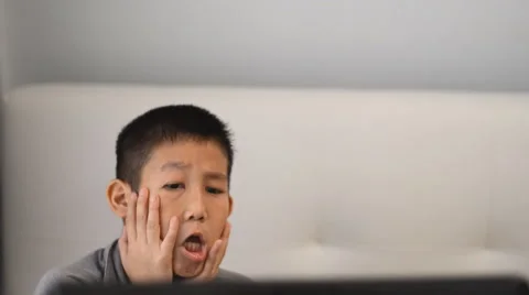 Boy playing game on computer Stock Footage 57362201