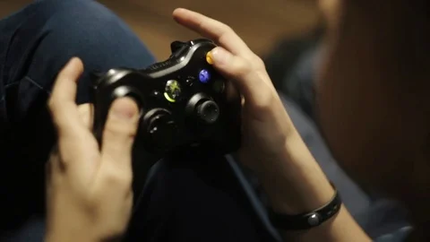 Boy playing game console joystick Stock-Footage 75079553