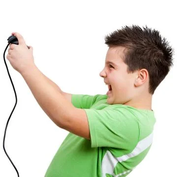 Boy playing with game console Stock Photos