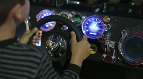 A boy playing a game on the game simulator Stock Footage 64941628